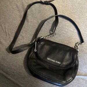 Black leather Michael kors crossbody with silver accents